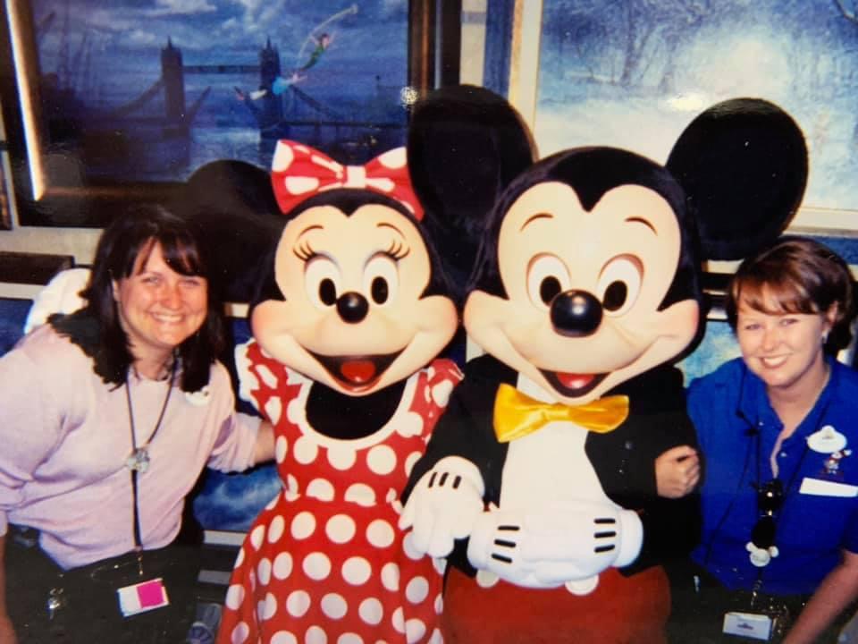 Tammy Vallario smiles next to Minnie and Mickey Mouse