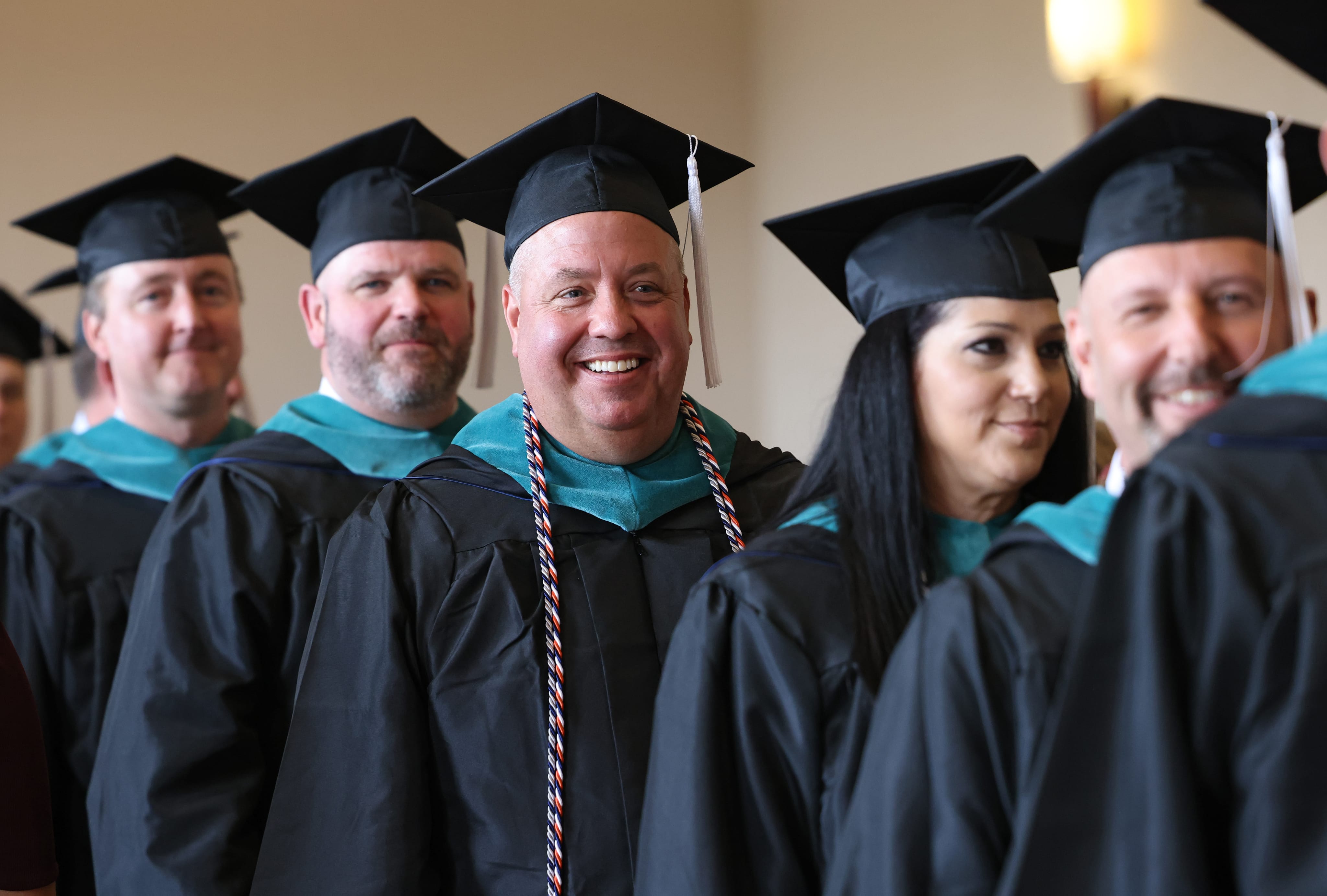 People is cap and gowns graduating