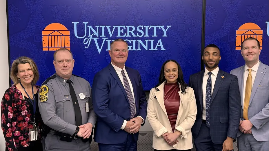 In order, Dean Melissa Lubin, Lieutenant Neil Johnson, Director Bill Humphrey, Deputy Chief Danielle M. Outlaw, William Paige, and Executive Director Ben Haiman stand next to each other in a row and smile. 